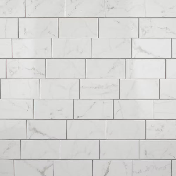 Merola Tile Classico Carrara Glossy Ceramic Subway Wall Tile 0.34 inch Thick 3 inch Wide 6.03 sq. ft. per Case – Marble Look High Sheen Finish