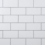 Load image into Gallery viewer, Merola Tile Crown Heights Matte White 3 inch x 6 inch Ceramic Wall Tile 5.72 sq. ft./case – Textured Matte Subway Finish